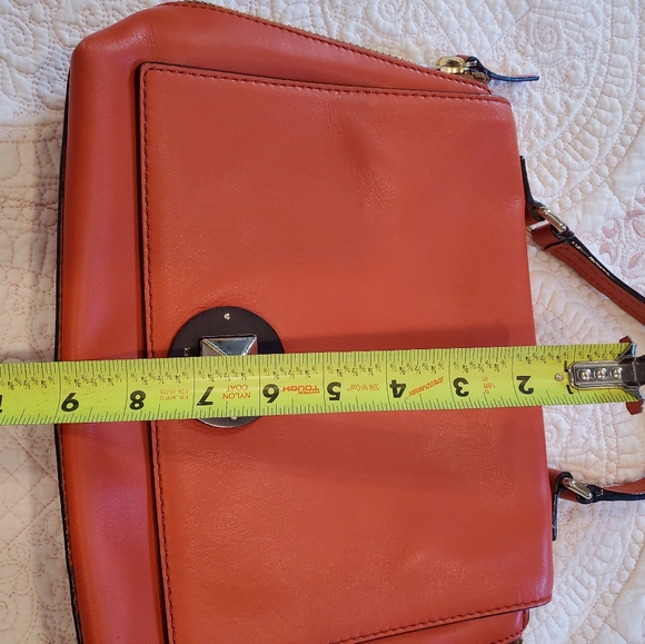 Kate Spade orange leather purse.  12" x 9" Two side zippers three inside pockets - Picture 11 of 11